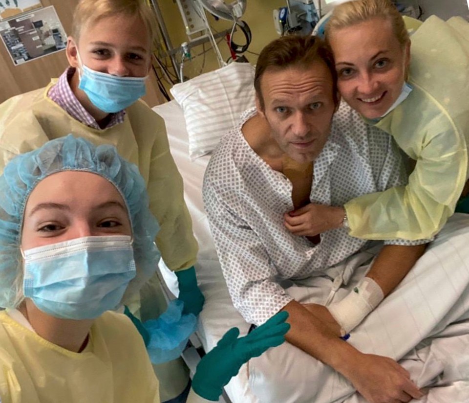 Alexei Navalny pictured here with his wife, Yulia, and medics after he woke from his 25-day coma in a Berlin hospital