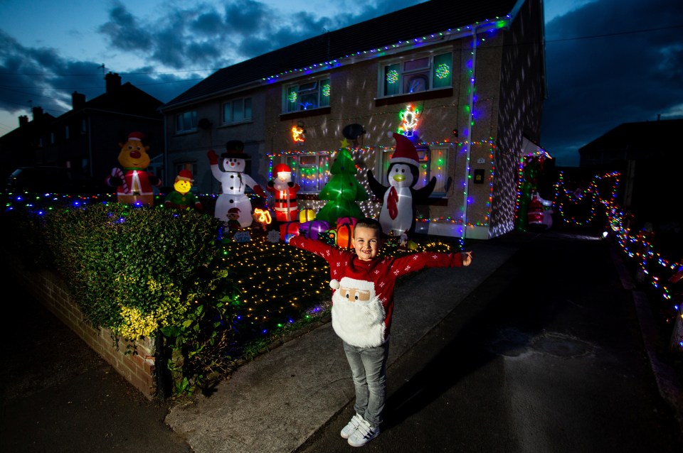 Caroline has cheered up her kids and neighbours by putting up her Christmas decorations three months early 