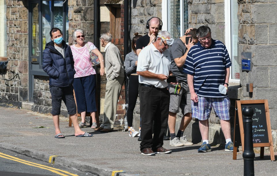 People pictured out and about in the town of Treorchy in the Rhondda Valley which is now in local lockdown 