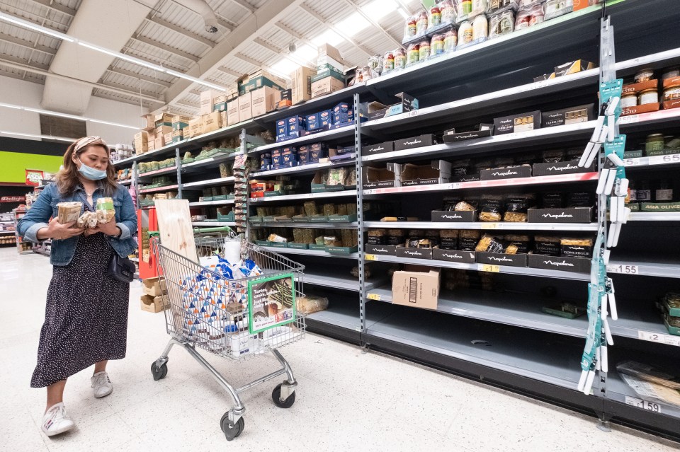 A customer buying pasta at an Asda store in Wembley, London