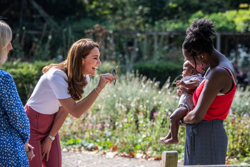 Kate appeared in good spirits during the socially-distanced meet