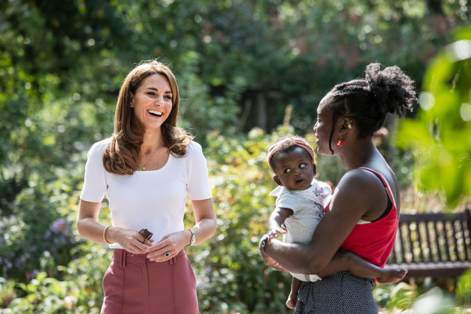 The Duchess of Cambridge beams as she met with representatives and volunteers from eight different organisations who run peer-to-peer support