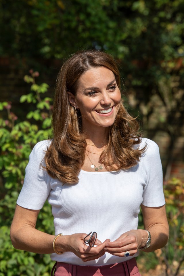 Kate wore her hair in her signature bouncy blow dry and kept her make-up looking natural