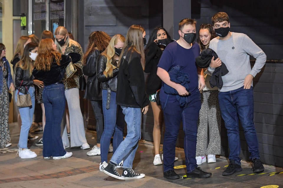 Party-goers queued to get into Players nightclub and the Figure of Eight Wetherspoons pub in Birmingham before it shut