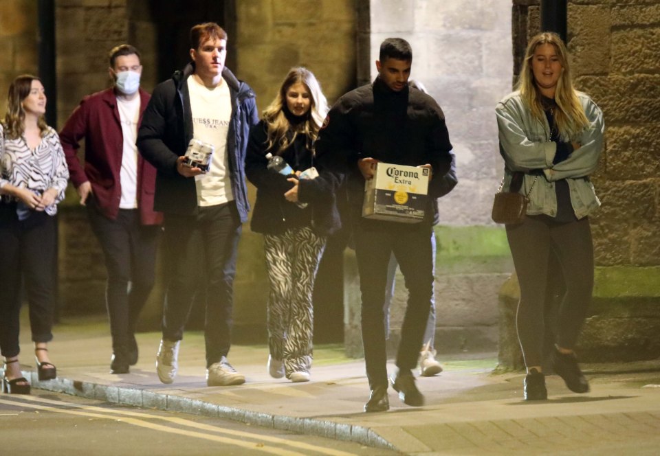 Students in Leeds carried a box of beer back home