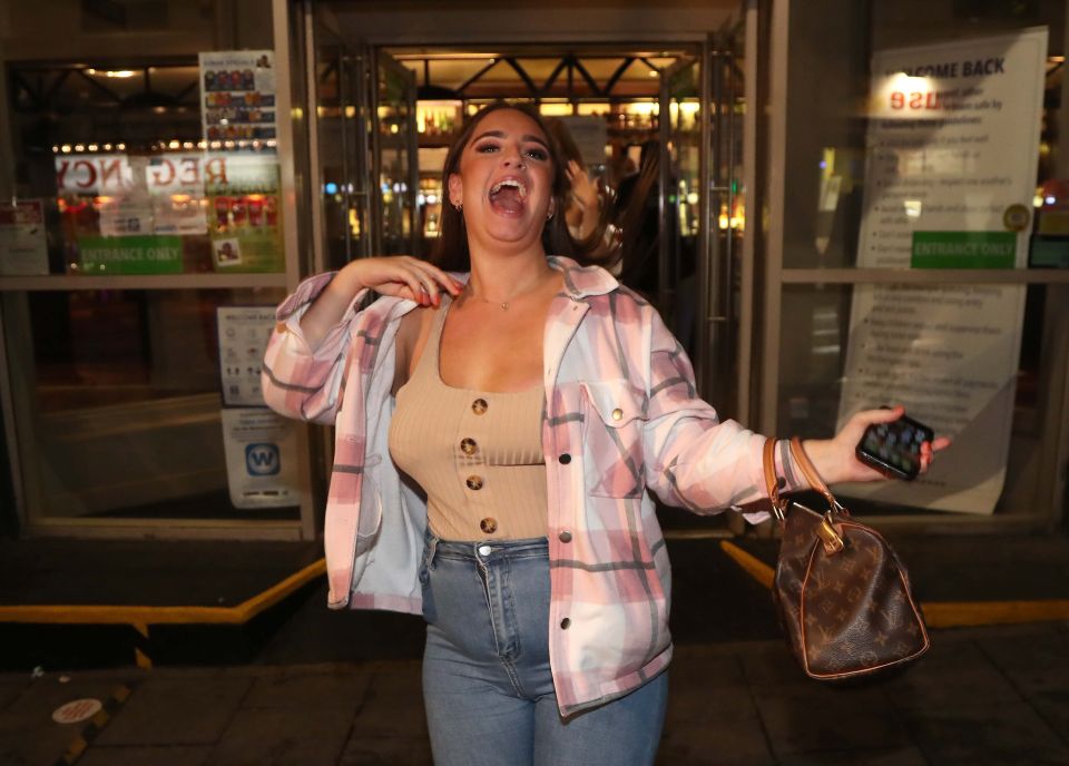 Revellers leave a Brighton Wetherspoon as a new 10pm curfew kicks in 