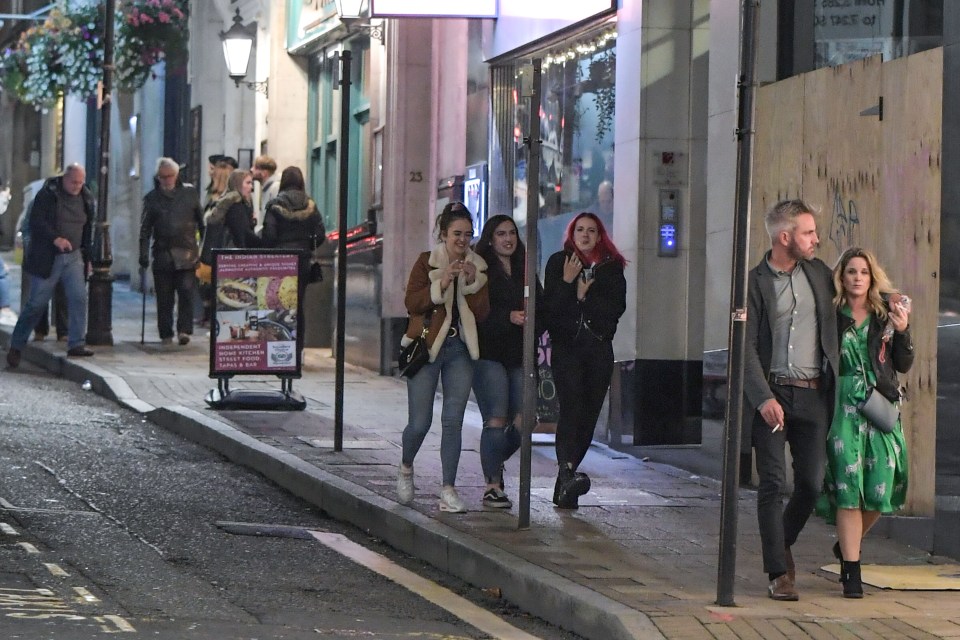 People walk home in Birmingham after the pub shut