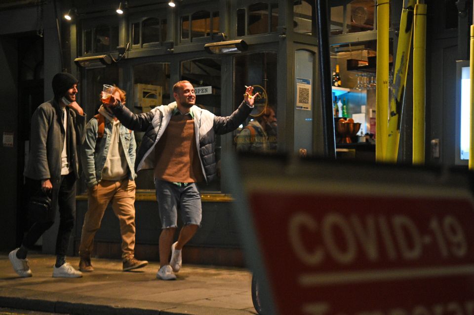 Drinkers left pubs with plastic pint glasses as the curfew began