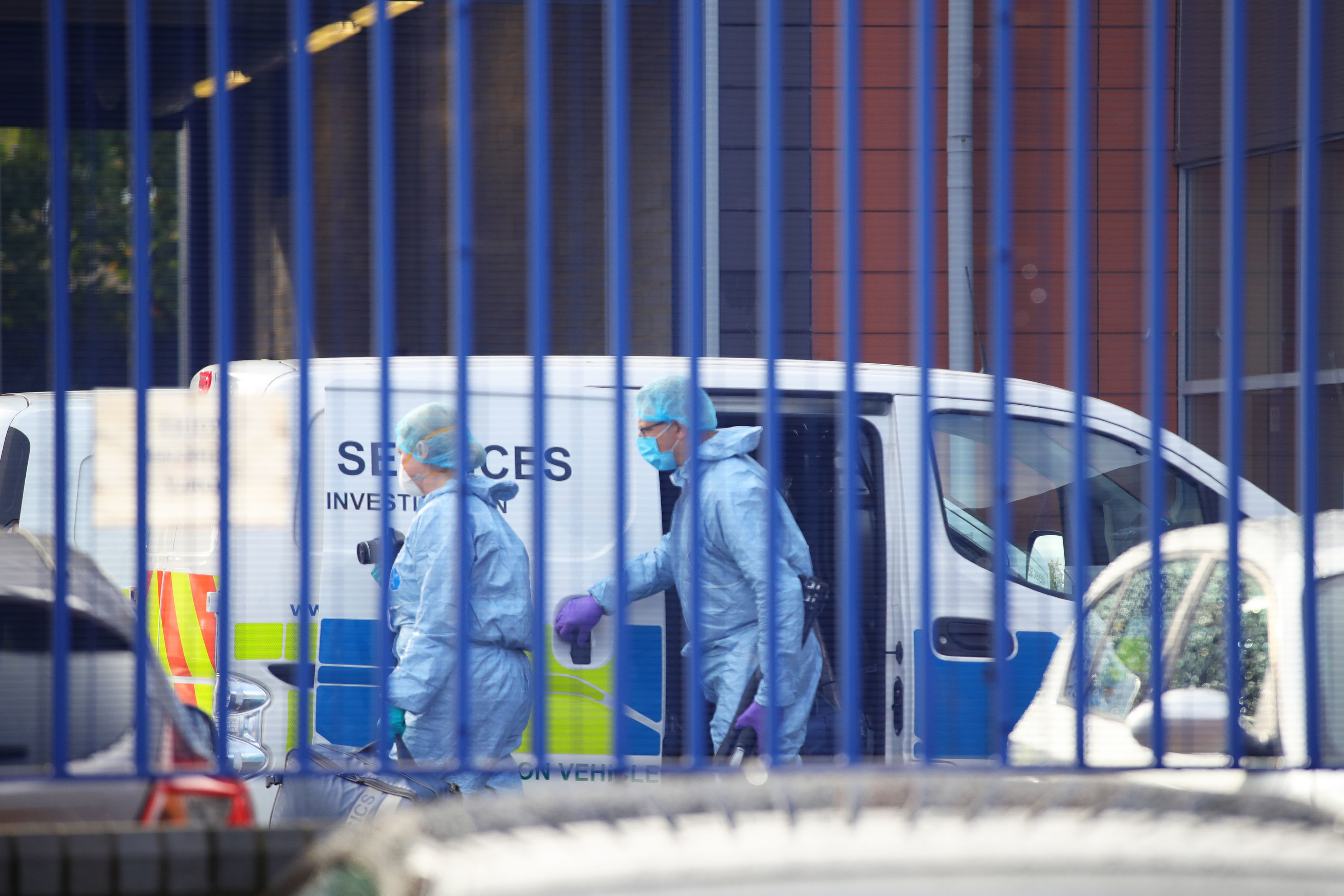 Forensics officers arrived at the scene as a murder investigation was launched