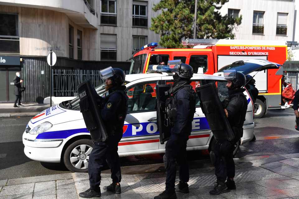 Riot police with shields on the scene