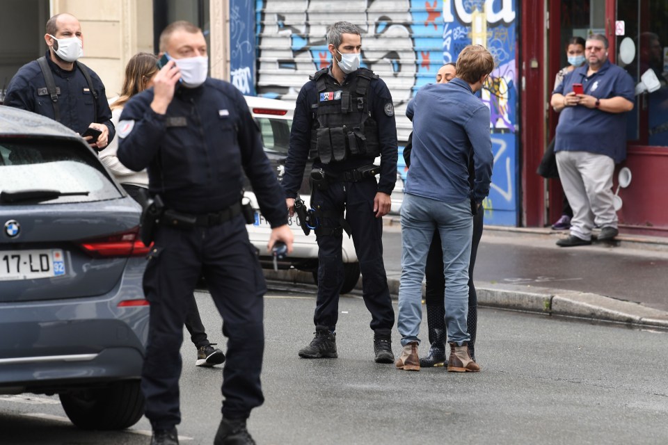 Two people embrace following the suspected terror attack