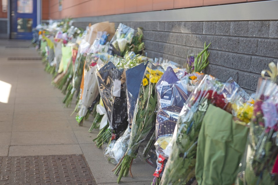 Floral tributes were left to the killed officer