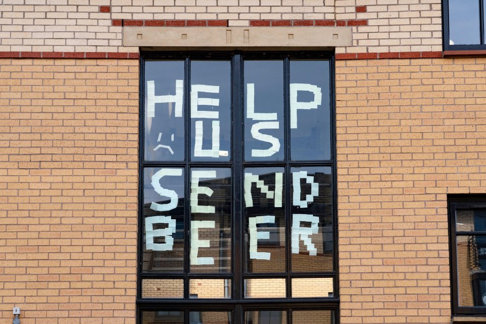 Angry students self-isolating inside halls in Glasgow put messages in their windows