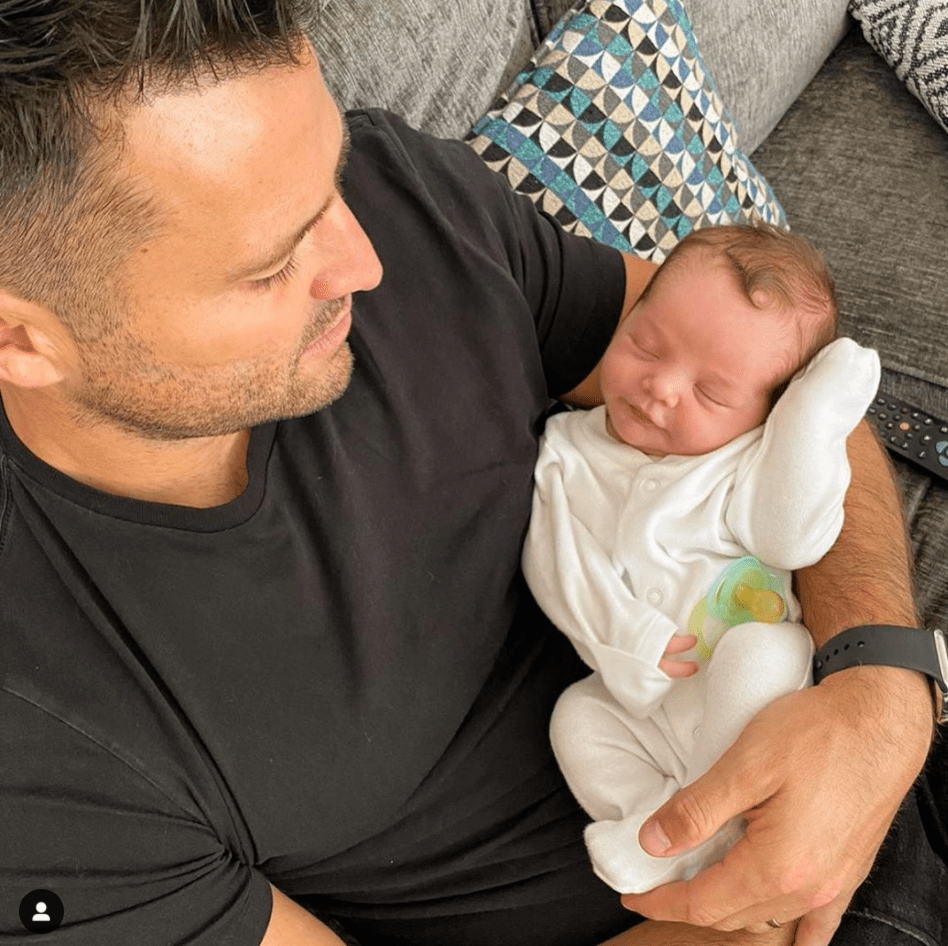 Mark Wright’s dad begged his son to ‘make him a grandad’ beneath a photo of Mark, 33, holding a newborn baby