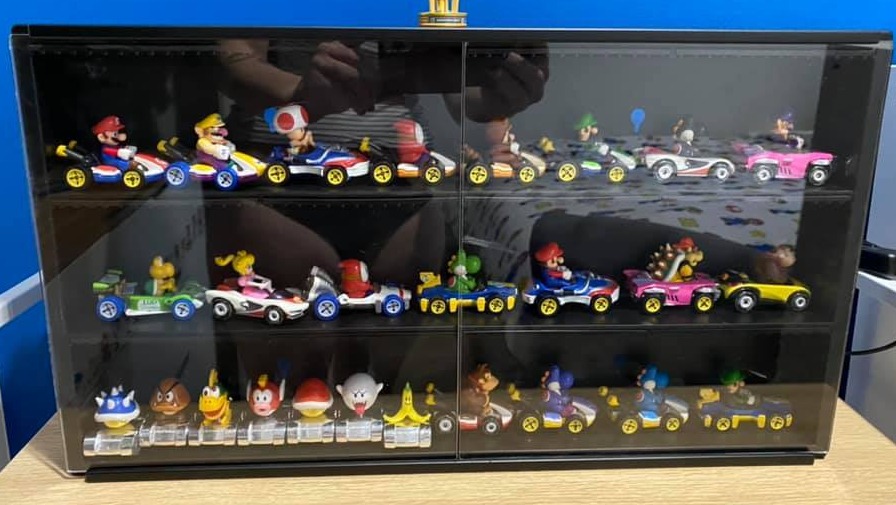 The mum shared a snap of her son's toys on Facebook, but didn't realise she captured her reflection too