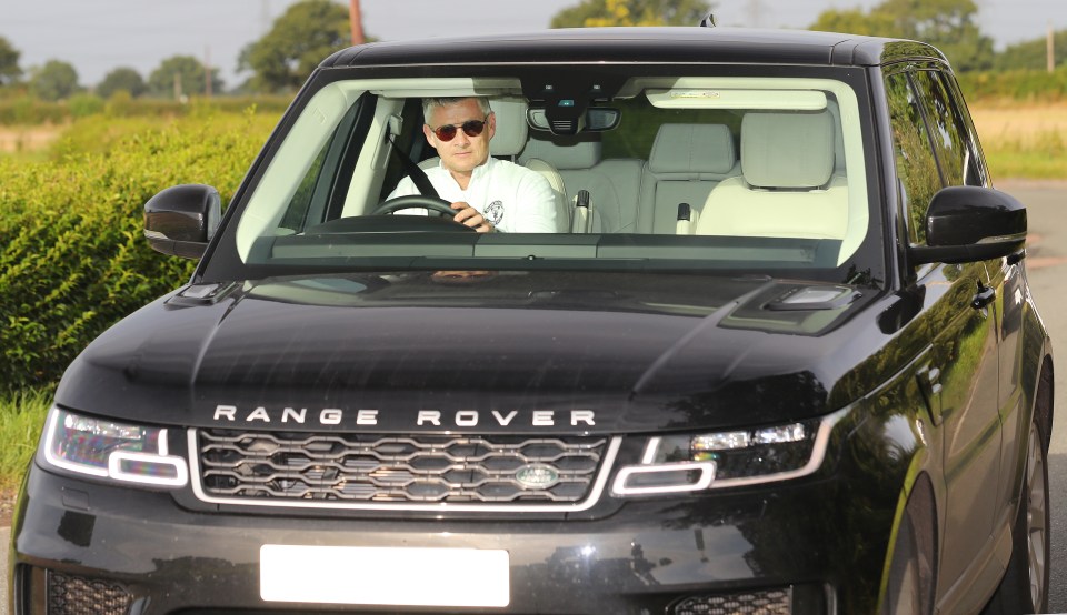 Manager Ole Gunnar Solskjaer arrives in his Range Rover