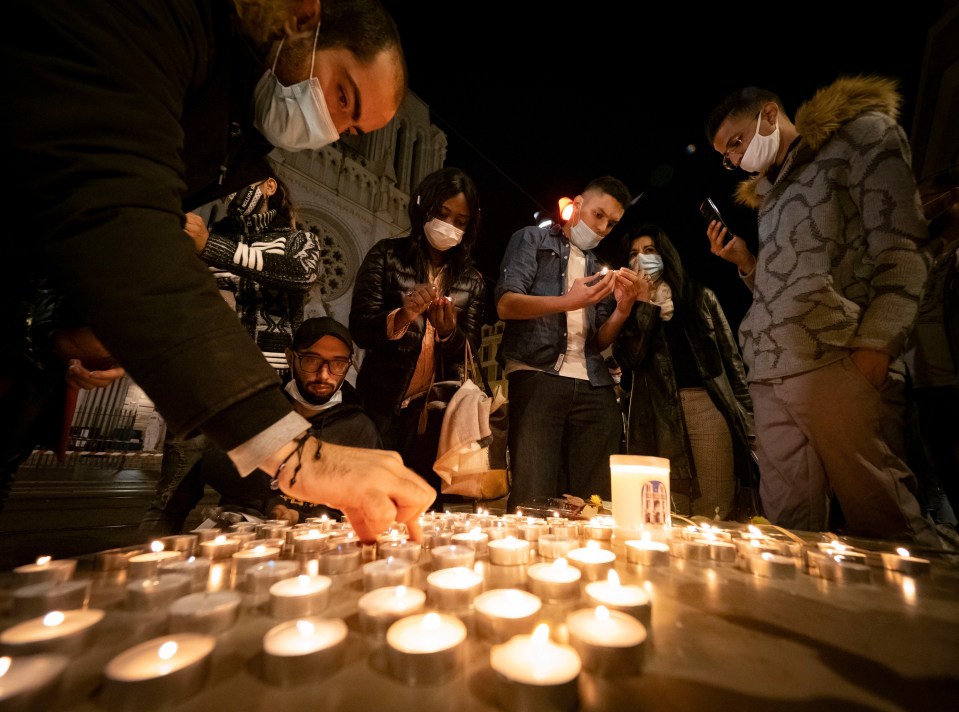 Candles are lit outside the Basilica of Notre-Dame in Nice