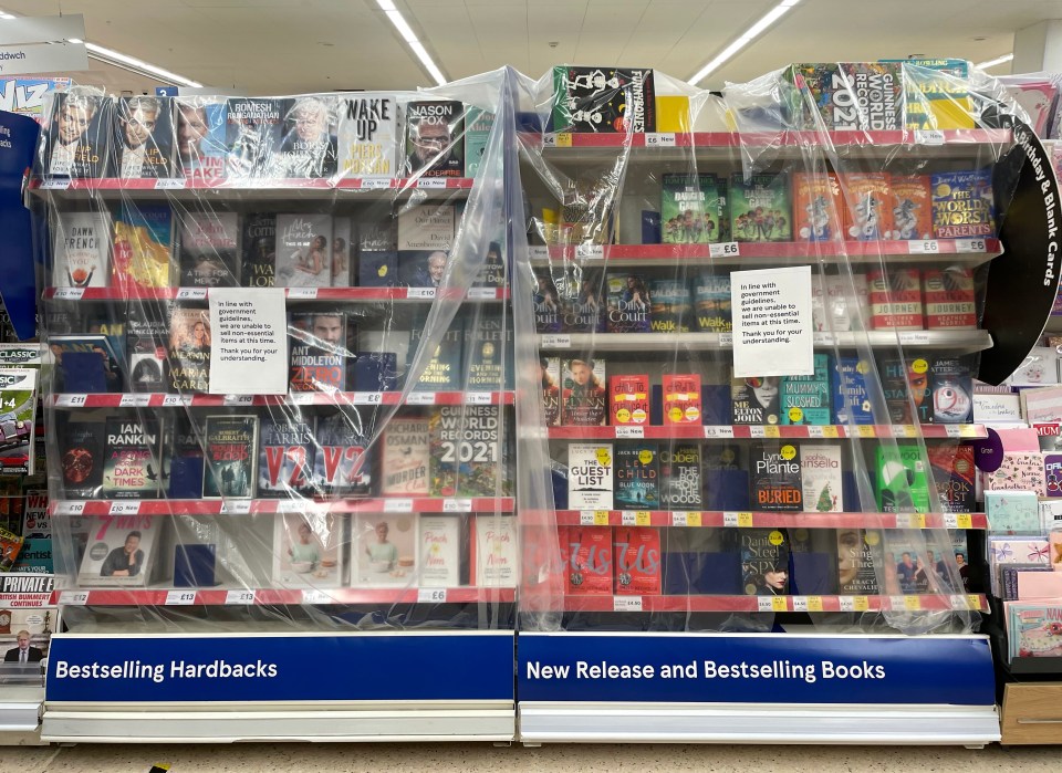 Shelves of books covered with plastic in a Tesco store in Penarth, Wales