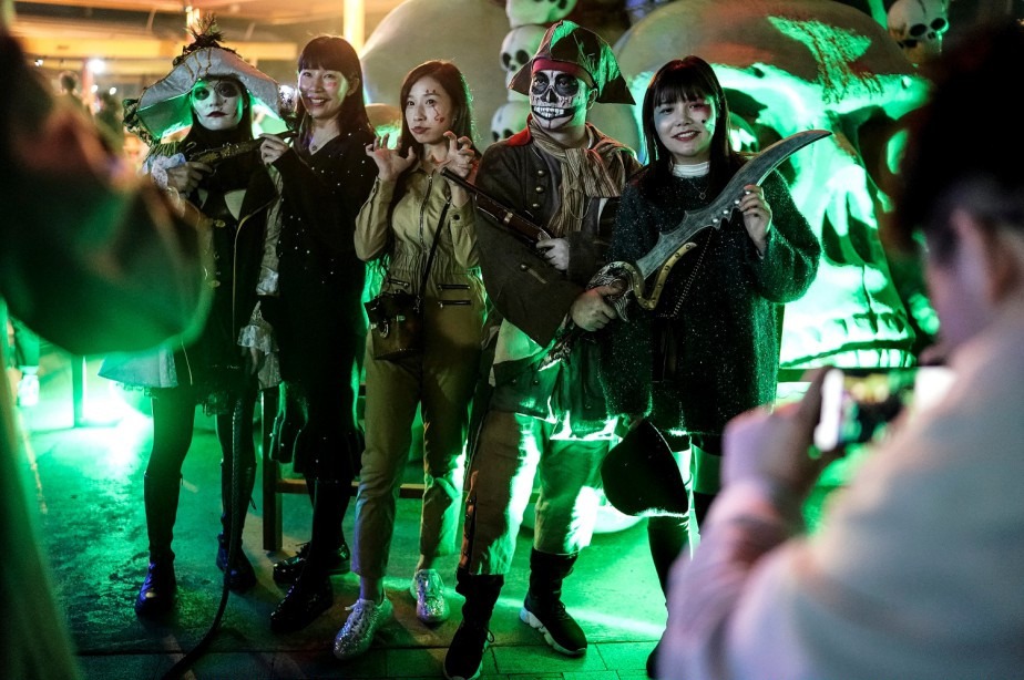 People celebrating in Halloween in Wuhan stopped to pose for pictures 