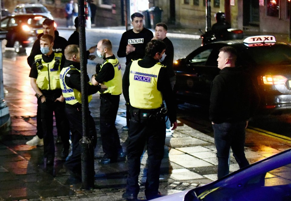 Police officers in facemasks patrol the streets in Newcastle