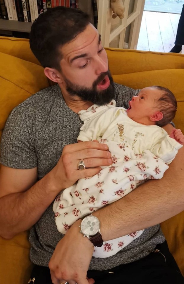 Jamie Jewitt looked like a natural while holding his newborn daughter 