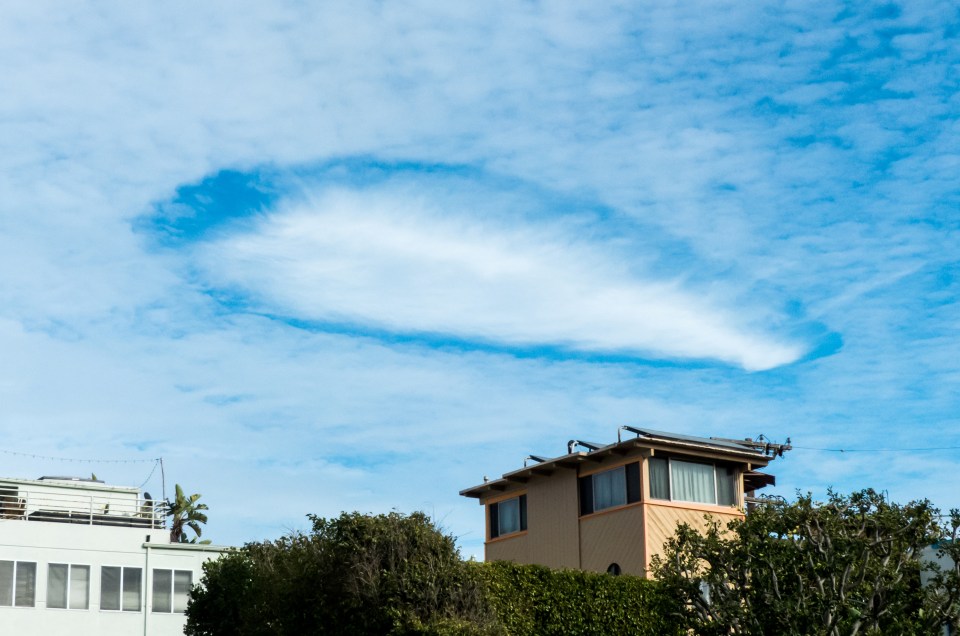 US beachgoers were stunned when this giant cloud suddenly materialised in the sky in Huntington Beach, California, in the shape of a UFO in 2017