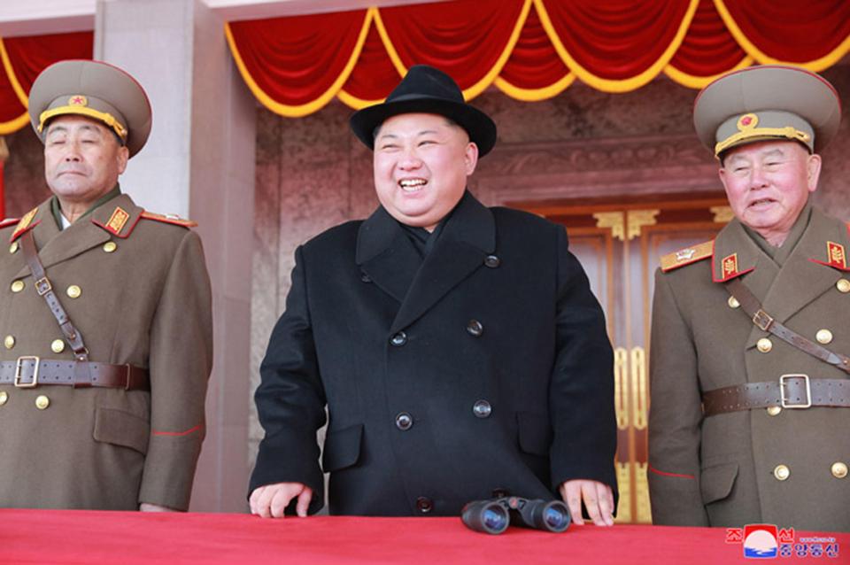 Kim Jong-un beams as he watches a previous North Korean parade