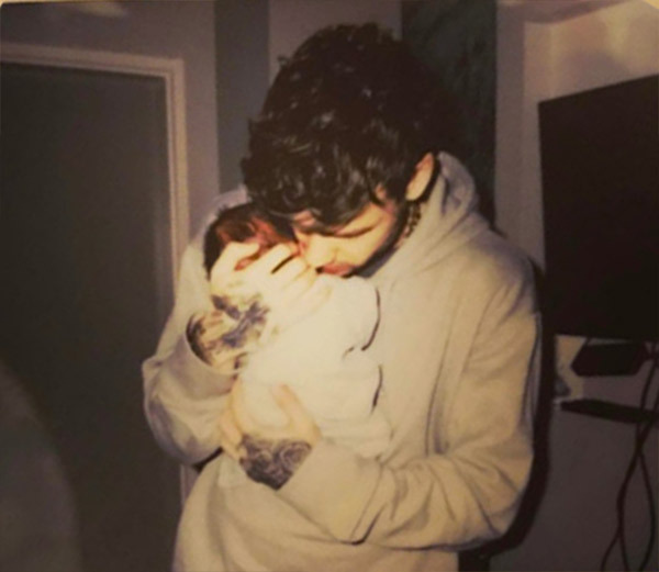 The ex-One Direction star cuddles new-born son Bear, now three