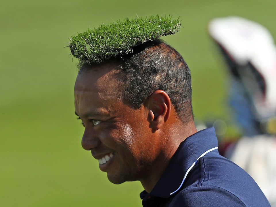 Woods jokes around with a divot on his head at the 2018 Ryder Cup