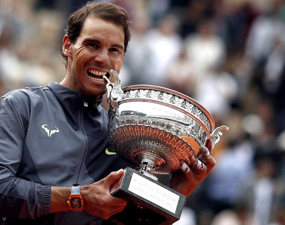 He will be hoping the new watch gets plenty of attention if he can be snapped posing with the trophy for a 13th time