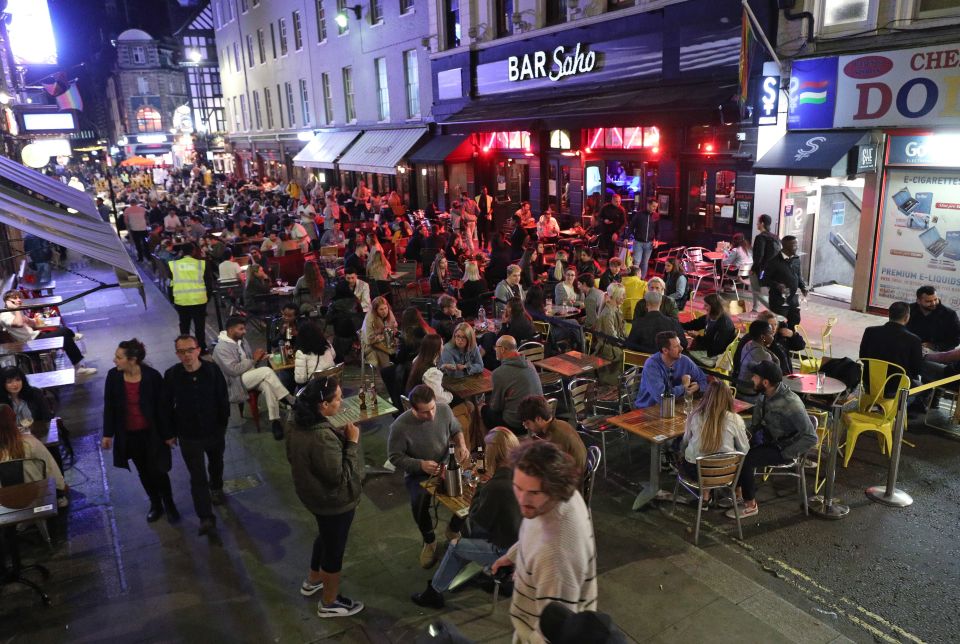 People eating out in Soho, London at the end of August