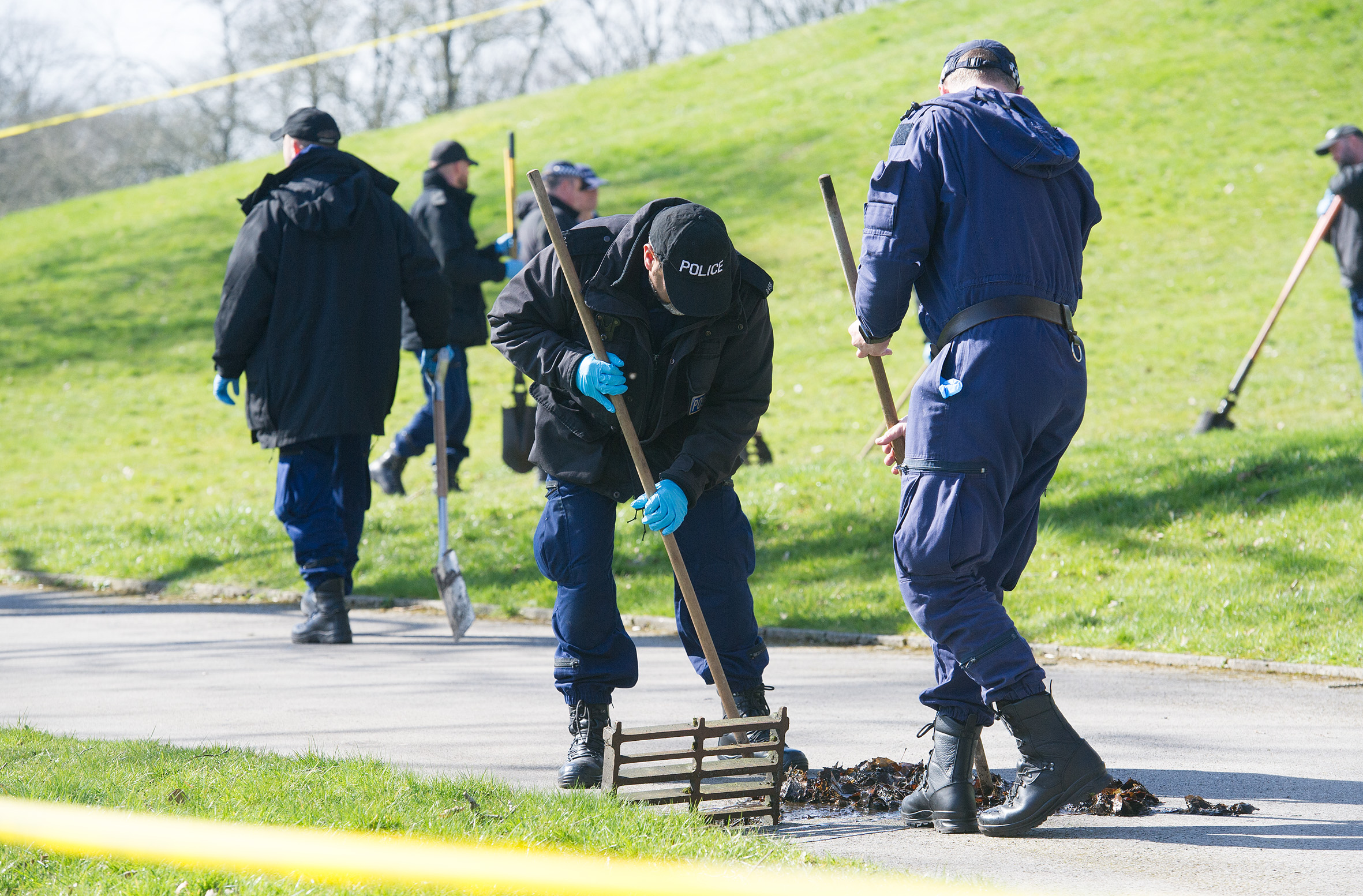 Cops are pictured at the scene earlier this year