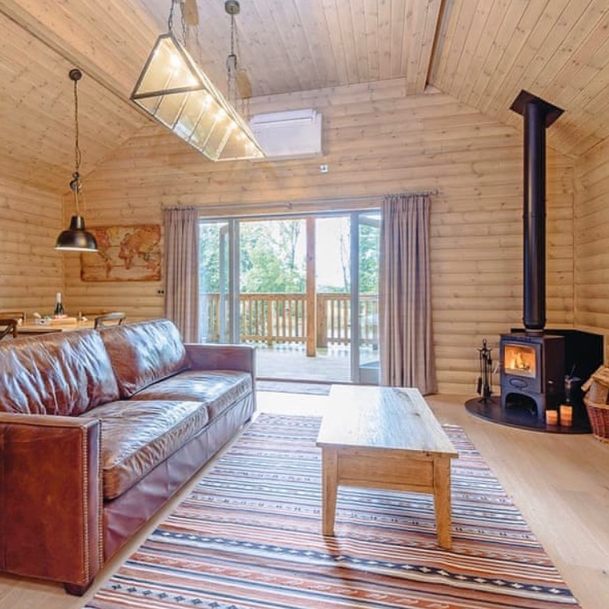 The cosy lounges in the woodland lodges feature log-fired burners