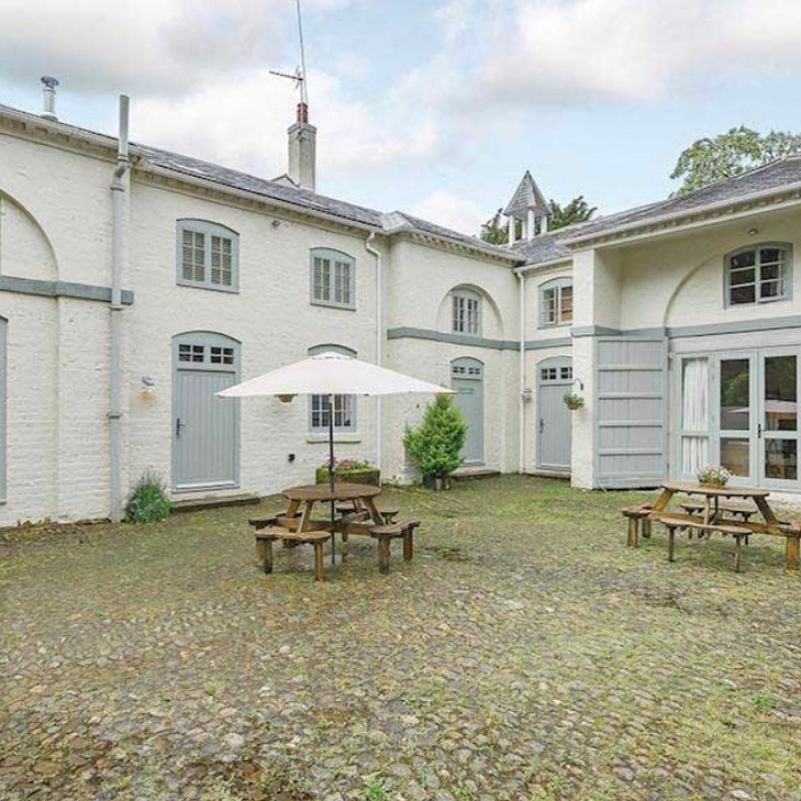 The log cabin was set in the grounds of a stunning Grade-II listed building