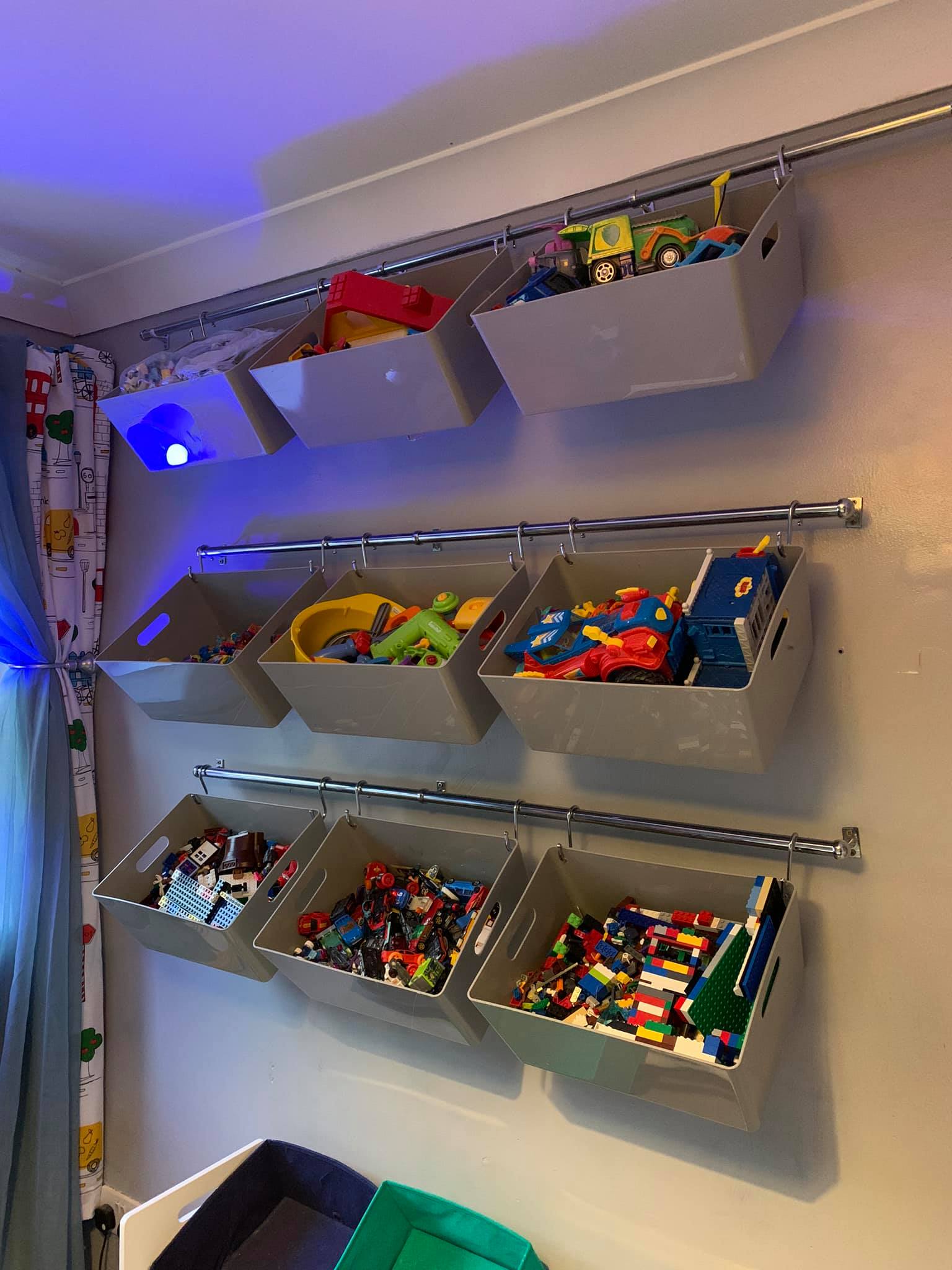 Hanging toys or other bits on the wall creates more floor space