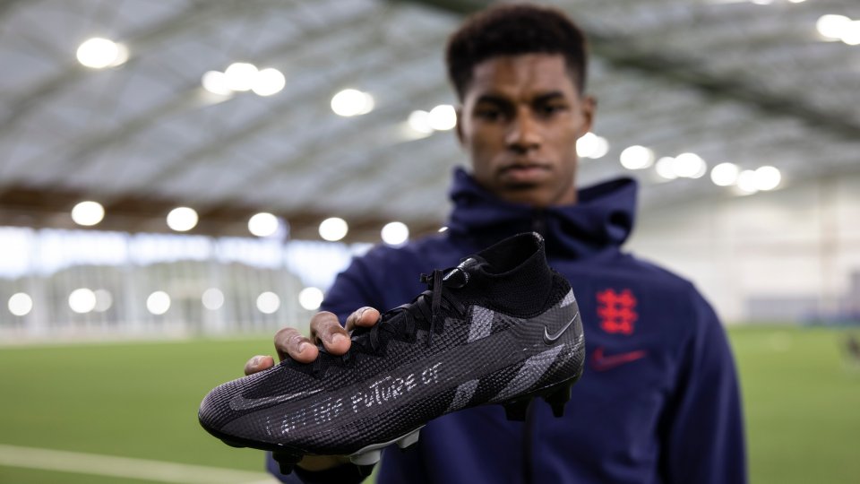 Rashford holds out his limited edition black boots