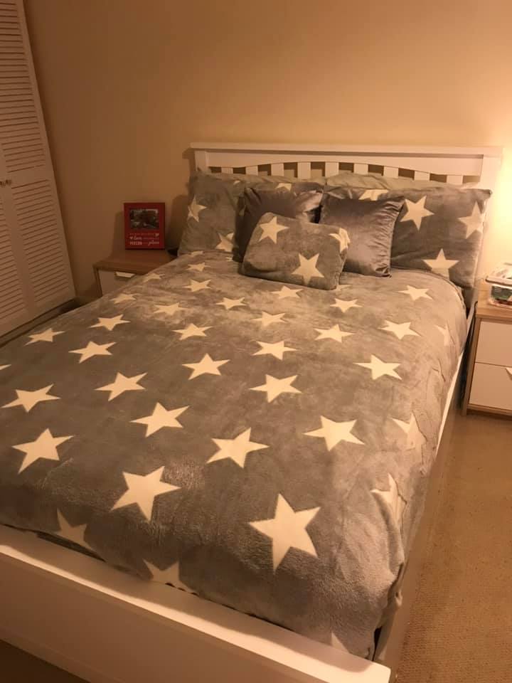 The grey teddy fleece bedding has glow-in-the-dark stars