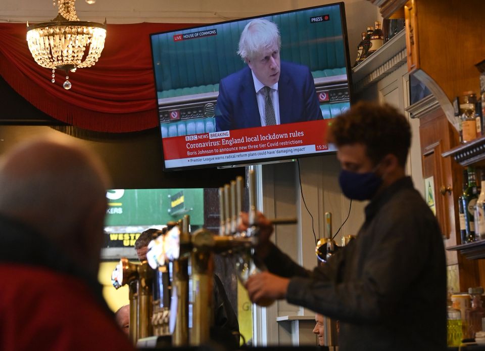 People in Merseyside enjoy a last pint before new lockdown rules kick in on Wednesday 