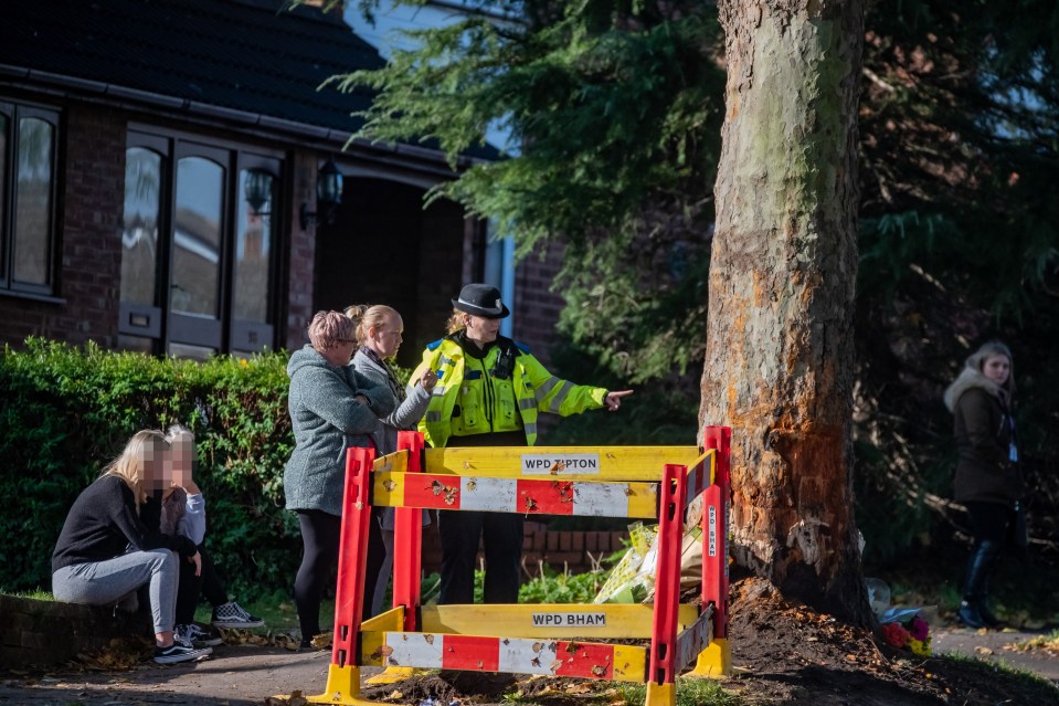 Police stand at the scene of the crash in Kingswinford