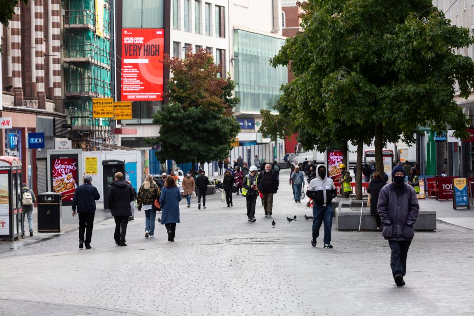 Shoppers wear masks as they walk through Liverpool city centre