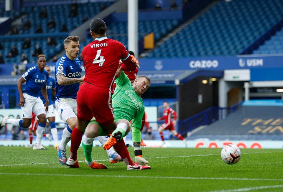 Pickford escaped punishment for this tackle on Van Dijk - leading to another debate about the effectiveness of VAR