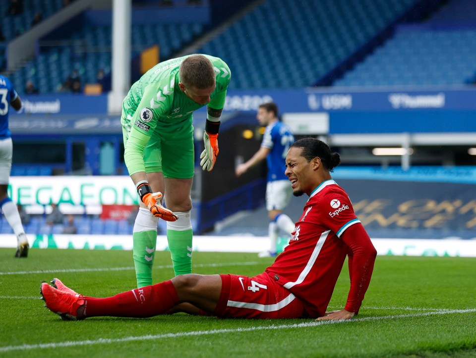 Pickford dived in at the feet of the Liverpool centre-back Van Dijk 