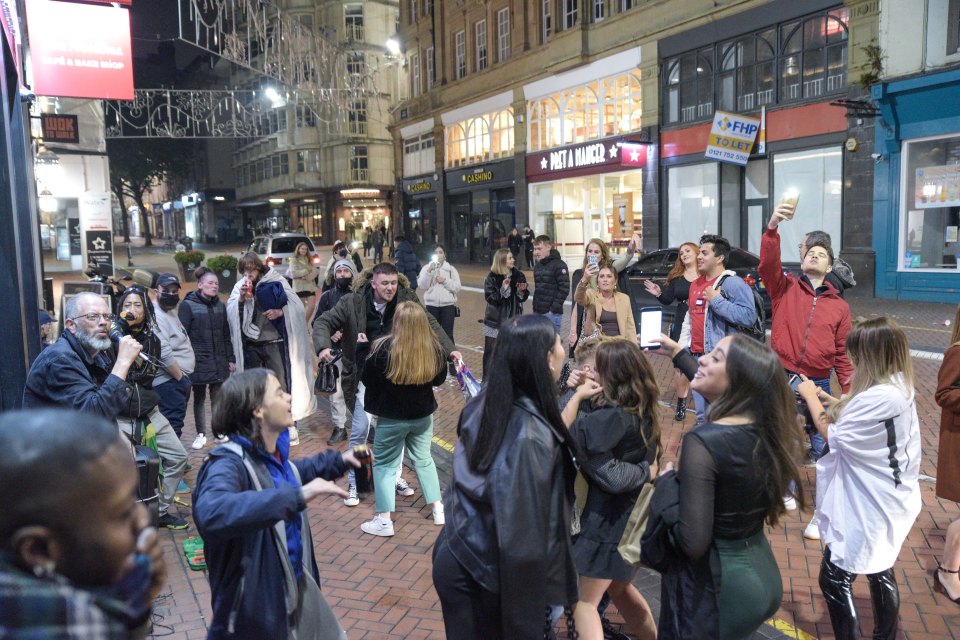 Revellers were pictured dancing in the streets of Birmingham after the area went into tier two