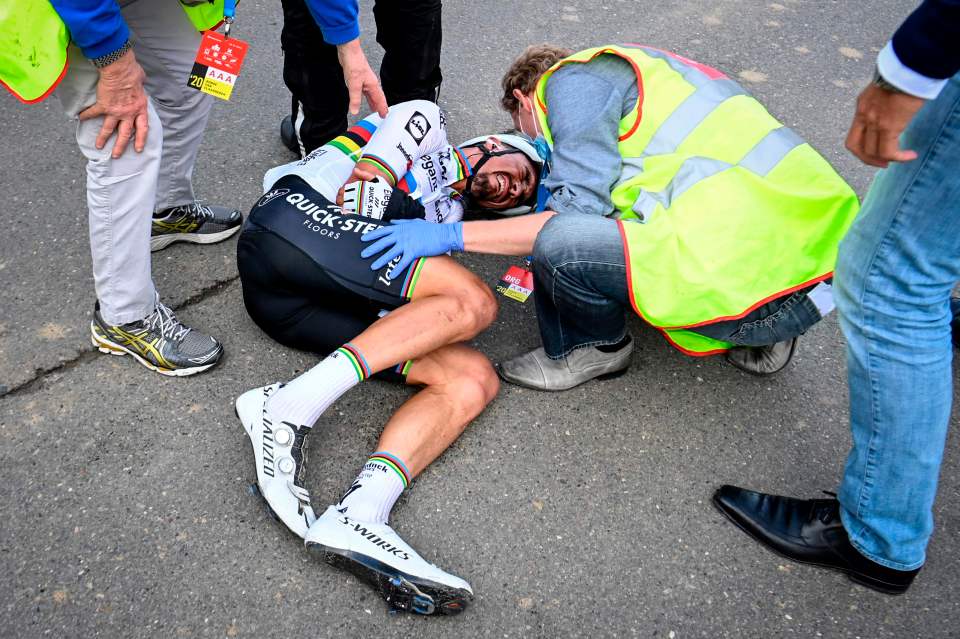 The world champion was left in a heap on the ground as medics attended to him 