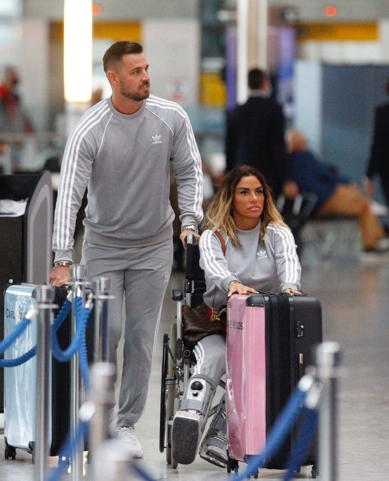 The couple flew out of London's Heathrow airport in matching grey tracksuits