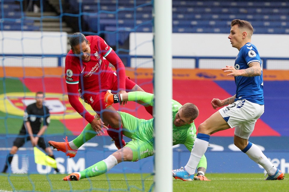 Van Dijk went off injured after being clattered by the Everton goalkeeper