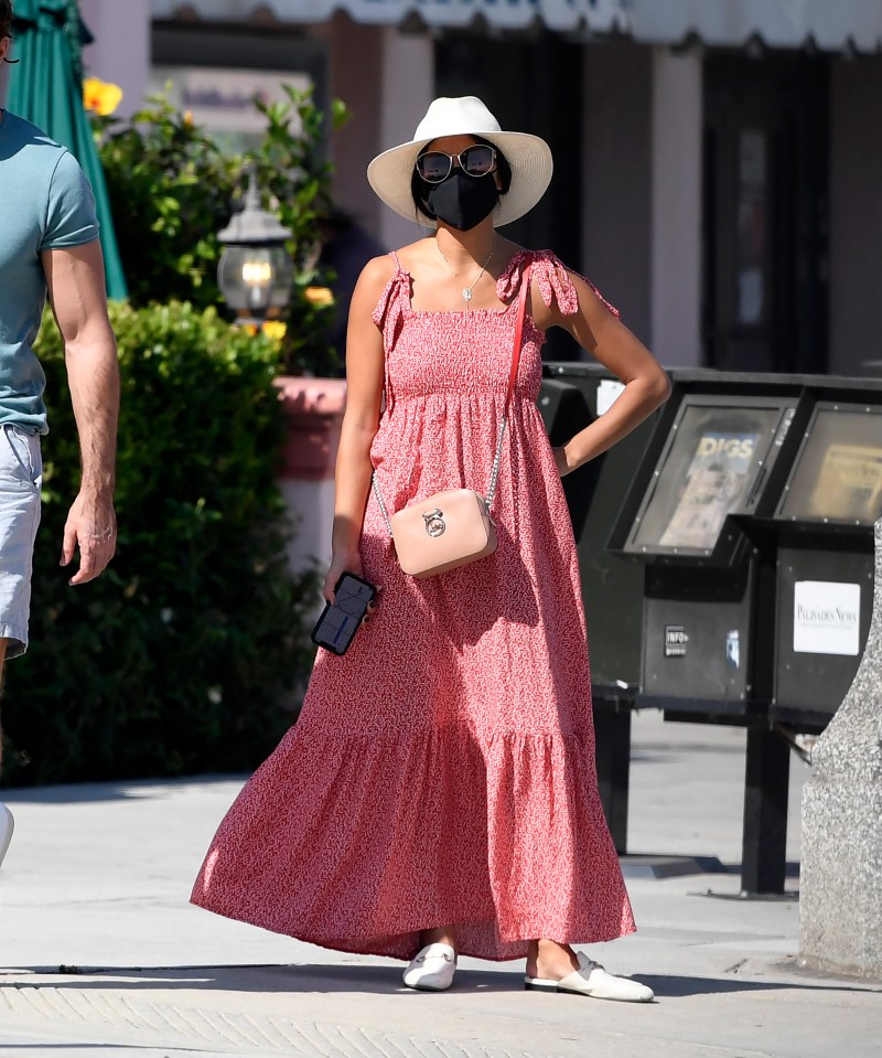 Nicola wore a red maxi dress and sunhat 