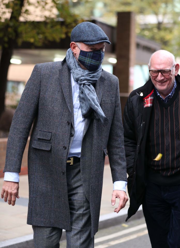 John Leslie appeared in good spirits as he left the court with his dad Les Stott