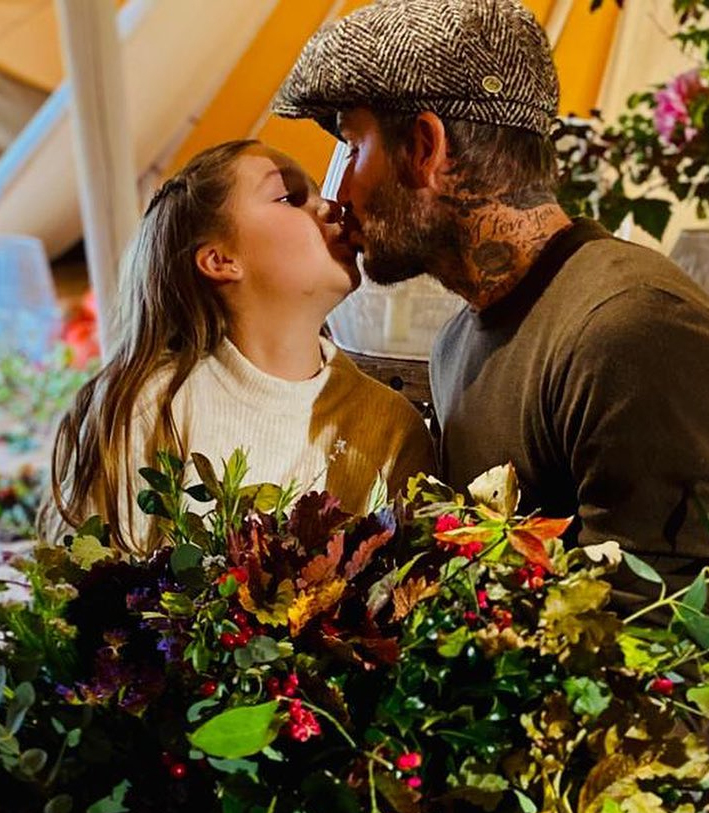 David Beckham was pictured giving daughter Harper a kiss as they enjoyed their day out at the farm