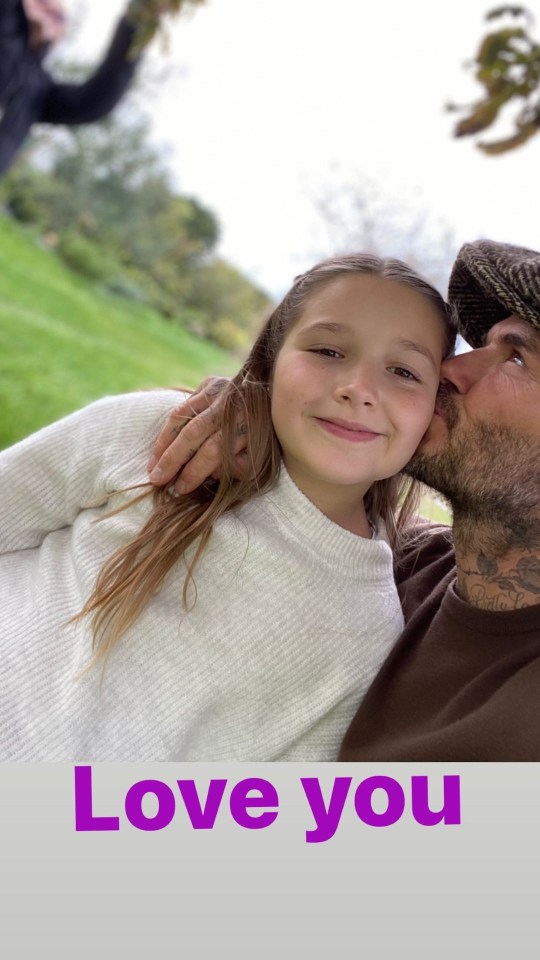 Doting dad David planted another kiss on his little girl